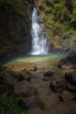 Jokkradin Waterfall is a single-level in the middle of the valley is very stunning and beautiful located near Ban-E Tong village Thong Pha Phum, Kanchanaburi Thailand. clipart