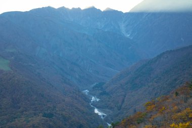 On the high mountains of Iwatake Ski Resort, easily see the beautiful scenery of the Japan Alps. In particular, during the autumn foliage season, you can see the colors of the leaves and the snow covering the mountaintop, Hakuba, Nagano, Japan clipart