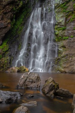 Khlong Lan Waterfall is one of the most beautiful and grand waterfalls in Thailand. The area above the cliff of the waterfall is a wide plain. Below the waterfall is a large pool where you can swim. It is located in Khlong Lan Waterfall National Park clipart