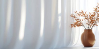 Soft sunlight filtering through sheer curtains with a vase of dried leaves. clipart