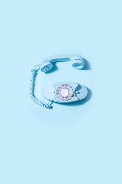 modern telephone and clock on blue pastel background. 3 d render. minimal concept