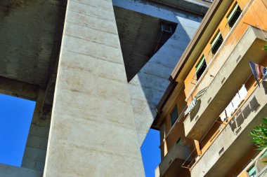 A cumbersome presence of concrete above our heads in Genoa clipart