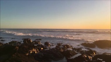 Deniz kıyısında gün batımı