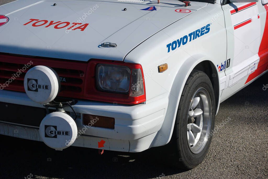Front of a Japanese brand car, modified for tuning restored with several brand logos