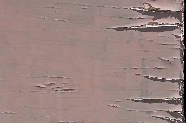 Ahşap yüzey dokusu aşınmış ve eskimiş boya kabuğu soyulmuş.