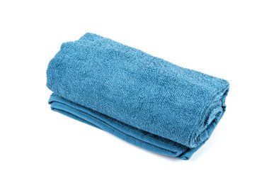 Rolled Blue Towel Isolated. New Terry Cotton Towel, Soft Washcloth on White Background