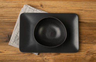 Empty Black Bowls and Plates on Wooden Table Background, Black Plate Mockup Top View, Rustic Kitchen Mock Up with Copy Space