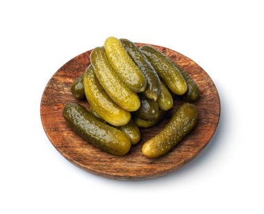 Pickled Cucumbers on Wood Plate Isolated. Fermented Food, Marinated Canned Vegetables, Gherkins, Pickled Cucumbers on White Background