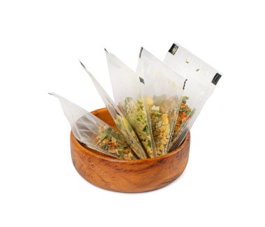 Small Spice Pouch Isolated, Dried Vegetables and Herbs Mix in Plastic Bag, Dry Peas, Greens, Dehydrated Food Pieces on White Background, Clipping Path