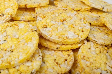 Puffed Corn Cake Texture Background. Corn Diet Bread with Fragrant Herbs and Spices, Waffle with Corns, Rice, Cereal Snack, Yellow Crackers, Diet Galettes on White Background