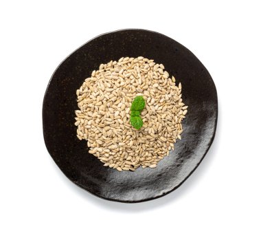 Peeled Sunflower Seeds, Raw Sunflower Kernels Group, Sun Flower Grains, Peeled Sunflower Seeds on Black Plate Background Top View