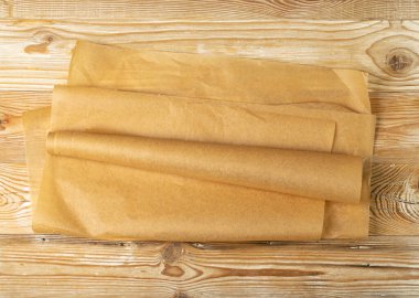 Brown Baking Paper, Kraft Cooking Paper Sheet Texture Background, Bakery Parchment Mockup, Greaseproof Material, Baking Paper on Wood Background Top View with Copy Space