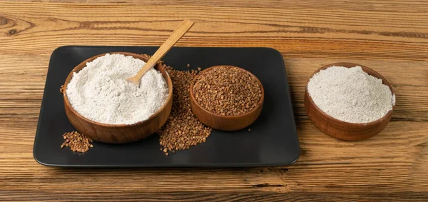 Buckwheat Flour Pile in Wood Bowl, Dry Buck Wheat Powder, Buckwheat Gluten Free Flour on Wooden Rustic Background