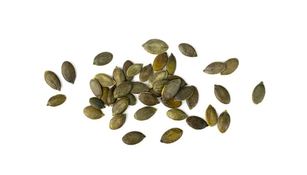 カボチャの種子隔離された 生のペピータの穀物 散在する緑の健康ナッツ 白地のカボチャの種子グループ — ストック写真