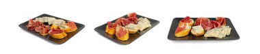 Prosciutto Tapas and Mold Cheese on Black Plate, Spanish Jamon Slices on Bread, Parma Ham , Sliced Serrano Canape, Iberico, Spanish Ham, Cured Meat Snacks for Wine