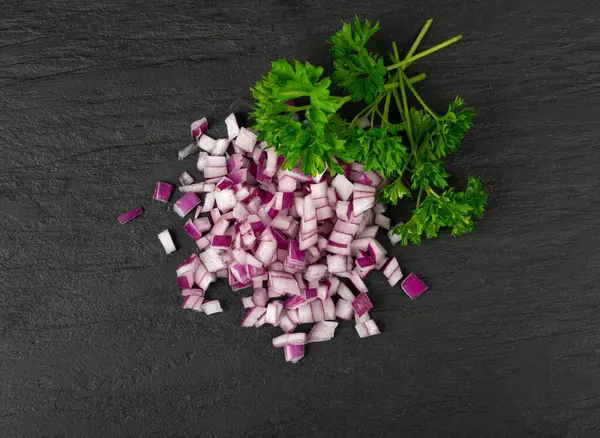 Red Onion Cuts, Raw Purple Onion Slices, Chopped Purple Onion Pieces on Black Rustic Table Background Top View