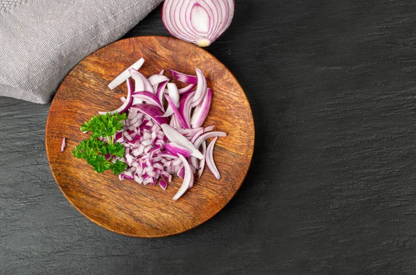 Red Onion Cuts on Wood Plate, Raw Purple Onion Slices, Chopped Purple Onion Pieces on Black Rustic Table Background