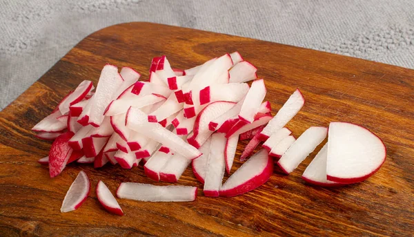 Sliced Radish Roots, Red Root Cuts, Red Radishes Slice Pile, Radis Pieces on Wood Cutting Board Background