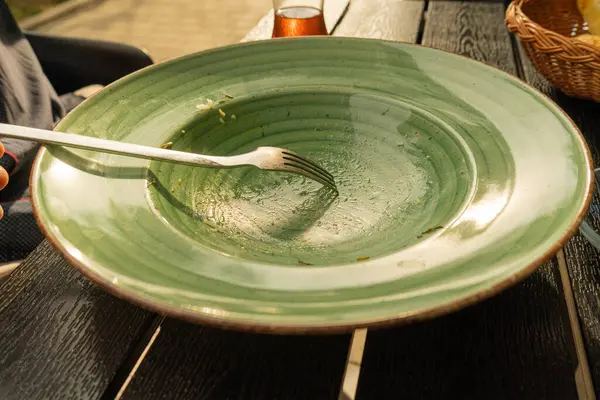 Dirty Green Plate, Empty Bowl after Dinner, Finished Lunch, Oil and Smeared Sauce on Big Plate