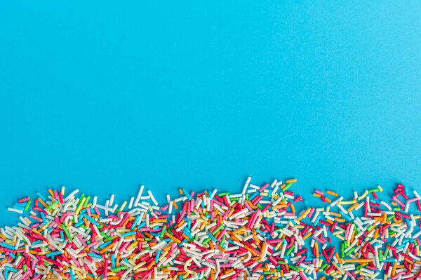 Конфетка посыпать текстуру фона, пончик Радуга Sprinkles Pattern, сладкий цвет глазури баннер, много маленьких Vermicelli Макияж с копирования пространства для текста