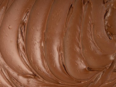 Erimiş çikolata desenli arka plan, çikolatalı sos deseni, kakao fındıklı krema, desenli çikolatalı maket, sıvı koyu macun, metin için kopyalama alanı olan kahverengi kremalı pankart.