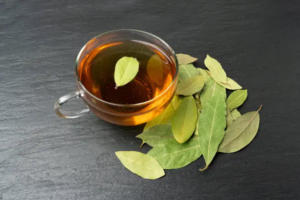 Bay Leaves Tea, Laurel Leaf Drink, Natural Spicy Bayleaf Infusion, Fragrant Beverage, Aromatic Spice, Dry Natural Tonic Energy Drink, Bay Leaves Tea on BlackBackground