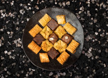 Baklava Set Top View, Ramadan Dessert, Eastern Sweet Filo Pastries, Honey Baklawa, Oriental Desert, Small Baklava Pieces on Black Background clipart