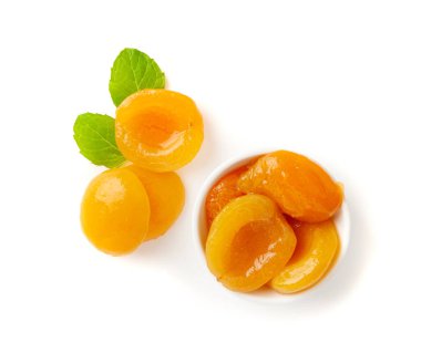 Canned Peaches in Bowl Isolated, Apricot Halves in Syrup, Yellow Fruit Dessert, Tinned Nectarine Compote, Orange Peeled Peache Slices on White Background clipart