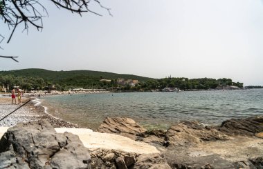 Zanjic, Montenegro, June 20, 2024 Adriatic sea in Zanjice Beach, Adriatic coast, Montenegro views, balkan coastline at high season, european tourism editorial image clipart