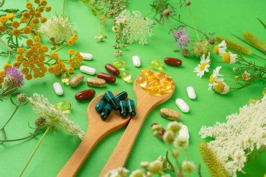 Bitkisel İlaçlar, Doğa İlaçları, Bitki Kapsülleri, Vitamin Mineral İlaçları, Sağlıklı Multivitamin İlaçları, Naturopati Hapları, İlaç ve Çiçeklerle çevrili Beslenme İlaçları