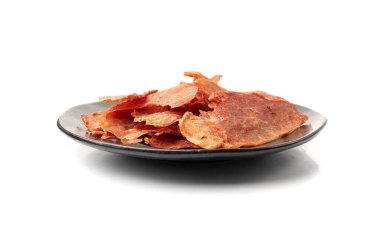 Meat Jerky Isolated, Dry Salted Chicken Slices on Black Plate, Small Pieces of Dehydrated Beef, Beer Snacks, Dried Pork Fillet, Dog Snack, Jerkies on White Background clipart