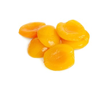 Canned Peaches Pile Isolated, Apricot Halves in Syrup, Yellow Fruit Dessert, Tinned Nectarine Compote, Orange Peeled Peache Slices on White Background clipart