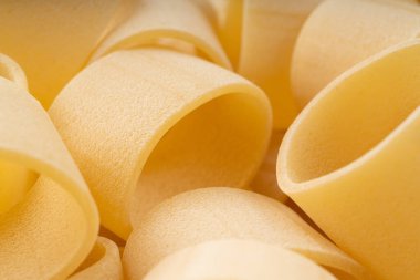 Çiğ Calamarata Big Pasta Makro Doku Özgeçmişi, Ev Yapımı Kuru Makarna Örnekleri, Pişmemiş İtalyan Yuvarlak Erişte Banner, Calamarata Makarna Halkaları Kopya Boşluğu Model