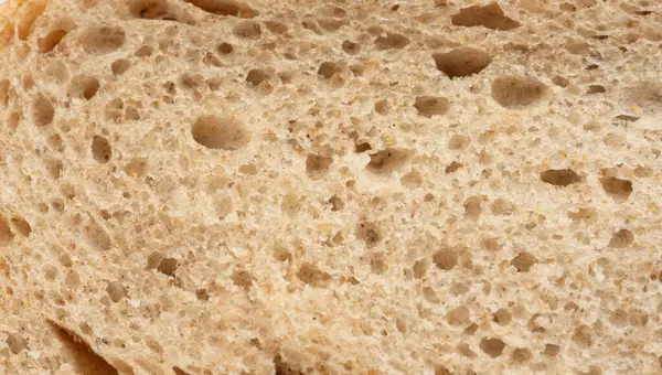 Ekmek dilimi makro doku, fırında hamur deseni. Beyaz ekmek somunu yakın kes, buğdaylı tost dilimi arka plan, sünger fırın afişi yakın plan ve fotokopi alanı ile üst manzara