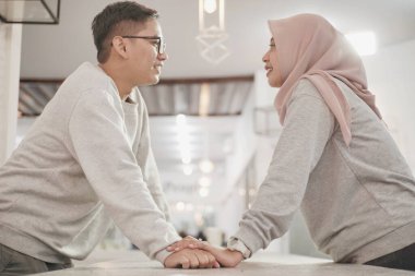 Muslim couple, hands together for support and empathy with care and love, solidarity and trust in relationship. Help, comfort and bonding with commitment in Islam, people in marriage with respect clipart