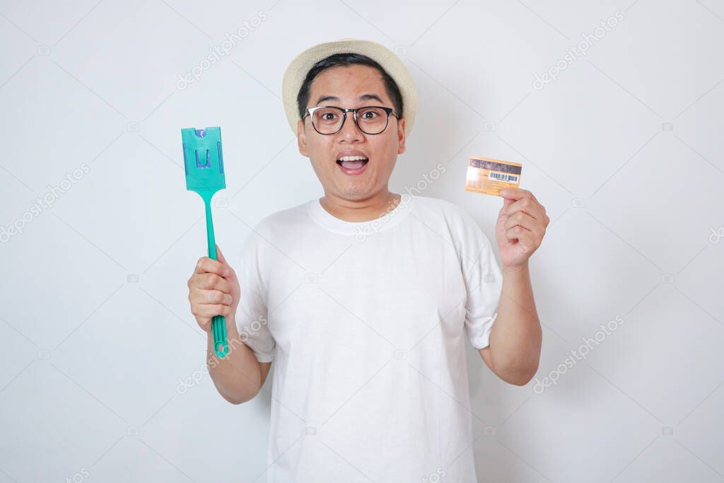 Asian men holding E-toll card and credit card on isolated background