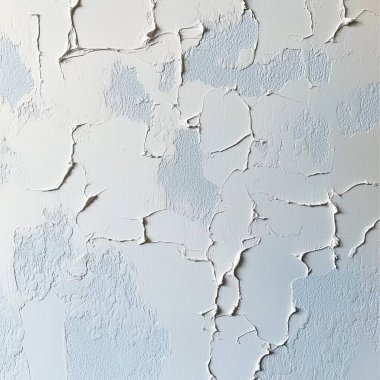 cracked paint on a white wall. texture background