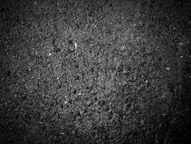 Sert taş tanecikli koyu asfalt yol dokusu gerçekçi ve yüksek çözünürlüklü bir yüzey sağlıyor. Arkaplan, inşaat ve endüstriyel tasarım projeleri için uygun.
