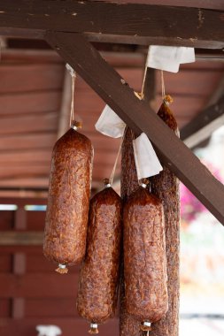 Hanging Smoked Sausage, Dried Salami, Chorizo, Wurst, Poland Kielbasa, Frankfurt Sausage, Longaniza on Village Market