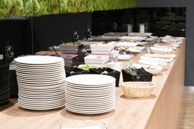 Stacks of Clean Plates at Hotel Breakfast Buffet, Lots of White Plates