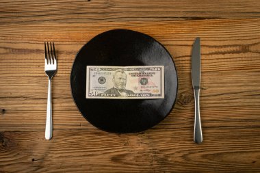 Money on Plate, Food Expenses Concept, Paper Dollar as Food, Eating Money, Pension, Scholarship, Subsidy, Living Wage, Banknote on a Plate Top View