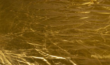 Crumpled Gold Fabric Texture Background, Wrinkled Bronze Pattern, Luxury Yellow Metallic Paper Mockup with Copy Space