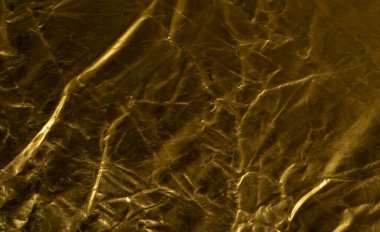 Crumpled Gold Fabric Texture Background, Wrinkled Bronze Pattern, Luxury Yellow Metallic Paper Mockup with Copy Space