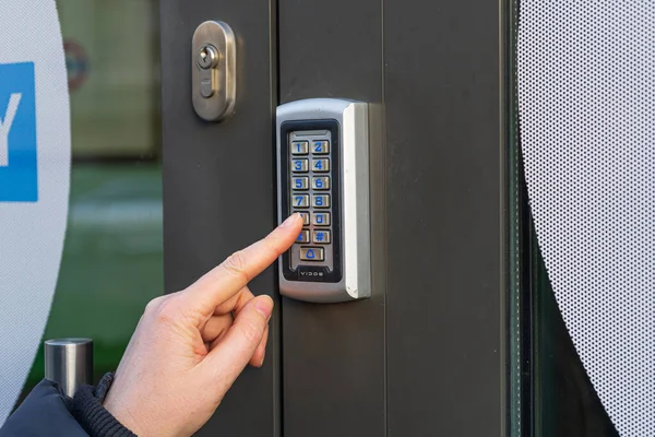 Secure Home System, Hand Pressing on Intercom Keypad, Using Door Phone, Doorphone, Entryphone, Videophone Call, Digital Electronic Doorbell