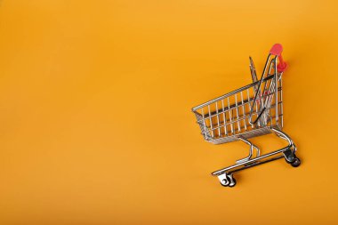 Shopping Basket on Yellow Background, Shopping Cart, Shop Cart Mockup, Empty Trolley, Supermarket Cart with Copy Space