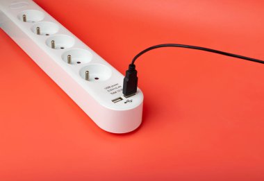 USB Plugs, Power Strip, Extension Cable, Electricity Strip USB Charging, Home Socket, Power Extender, Extension Cord on Pink Background with Copy Space