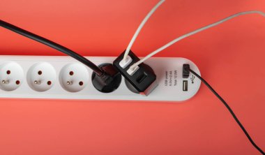 USB Plugs, Power Strip, Extension Cable, Electricity Strip USB Charging, Home Socket, Power Extender, Extension Cord on Pink Background with Copy Space