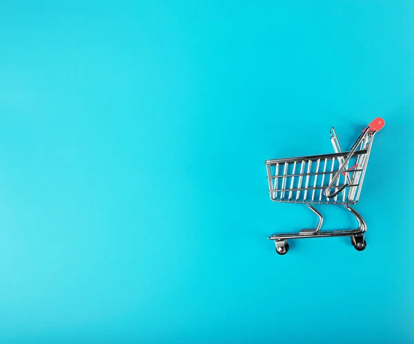 Shopping Basket on Blue Background, Shopping Cart, Shop Cart Mockup, Empty Trolley, Supermarket Cart with Copy Space