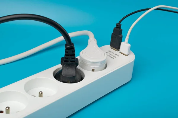 USB Plugs, Power Strip, Extension Cable, Electricity Strip USB Charging, Home Socket, Power Extender, Extension Cord on Blue Background with Copy Space