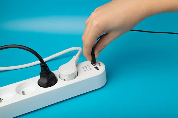 Turning on USB Plugs, Power Strip, Extension Cable, Electricity Strip USB Charging, Home Socket, Power Extender, Extension Cord on Blue Background